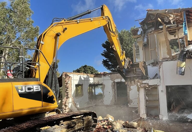 Professional demolition contractors Melbourne safely removing a building